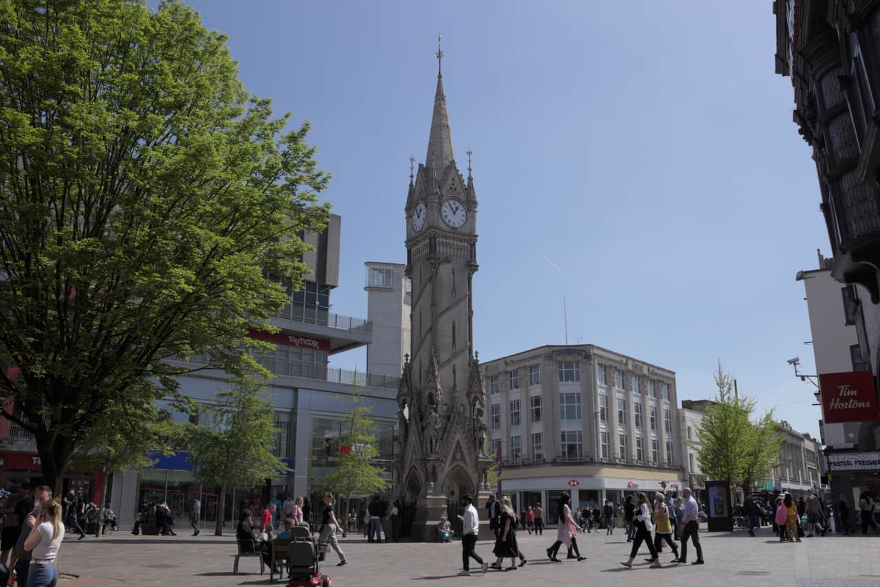 The Haymarket Memorial Clock Tower over a busy pedestrianised Leicester city centre